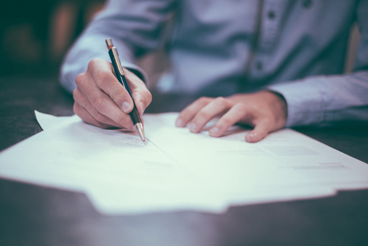 Counsellor preparing structured notes for an adult therapy session